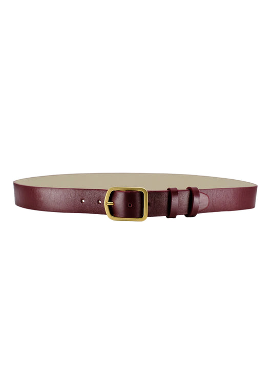 Horizontal view of Classic Red Mist smooth burgundy leather belt with a matte gold buckle and double leather loops.