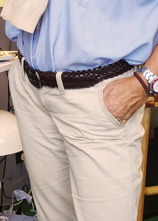 Espresso dark brown braided leather belt styled with beige chinos and a light blue button-down shirt.