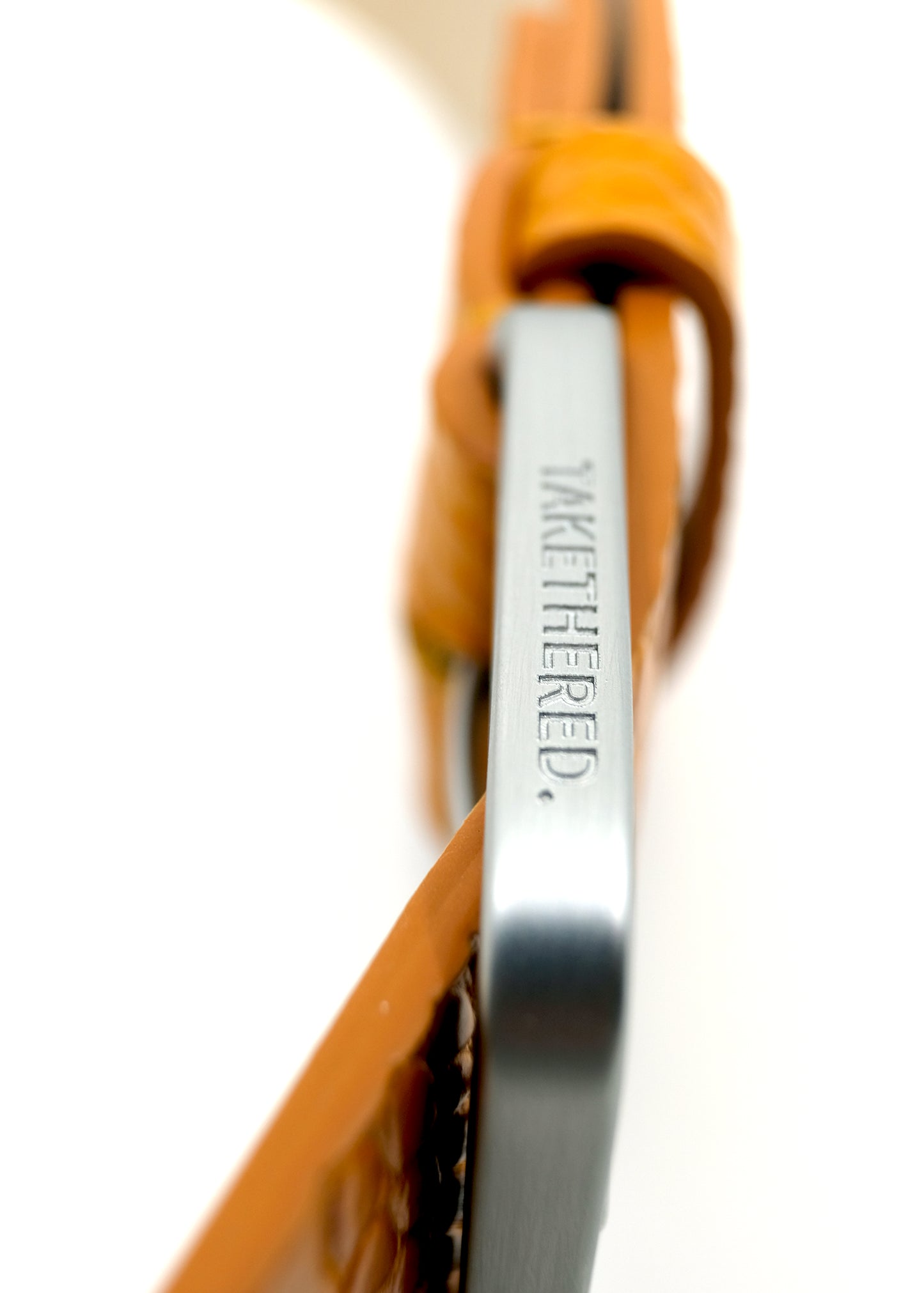 Side view of the yellow Mississippi Belt buckle in silver metal, engraved with the "BIRD & ASH" brand name.