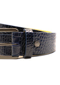Close-up of the navy Mississippi Belt showing alligator-embossed leather, a matte black buckle and a silver rivet.