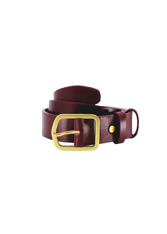 Coiled Classic Red Mist smooth burgundy leather belt with a matte gold buckle and matching leather loop.