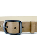 Close-up of Classic Truffle Brown leather belt with a gunmetal buckle and "TAKETHERED." engraved on the top edge.