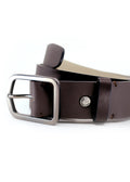 Close-up of Classic Espresso smooth dark brown leather belt with a gunmetal buckle and silver "TAKETHERED." rivet.