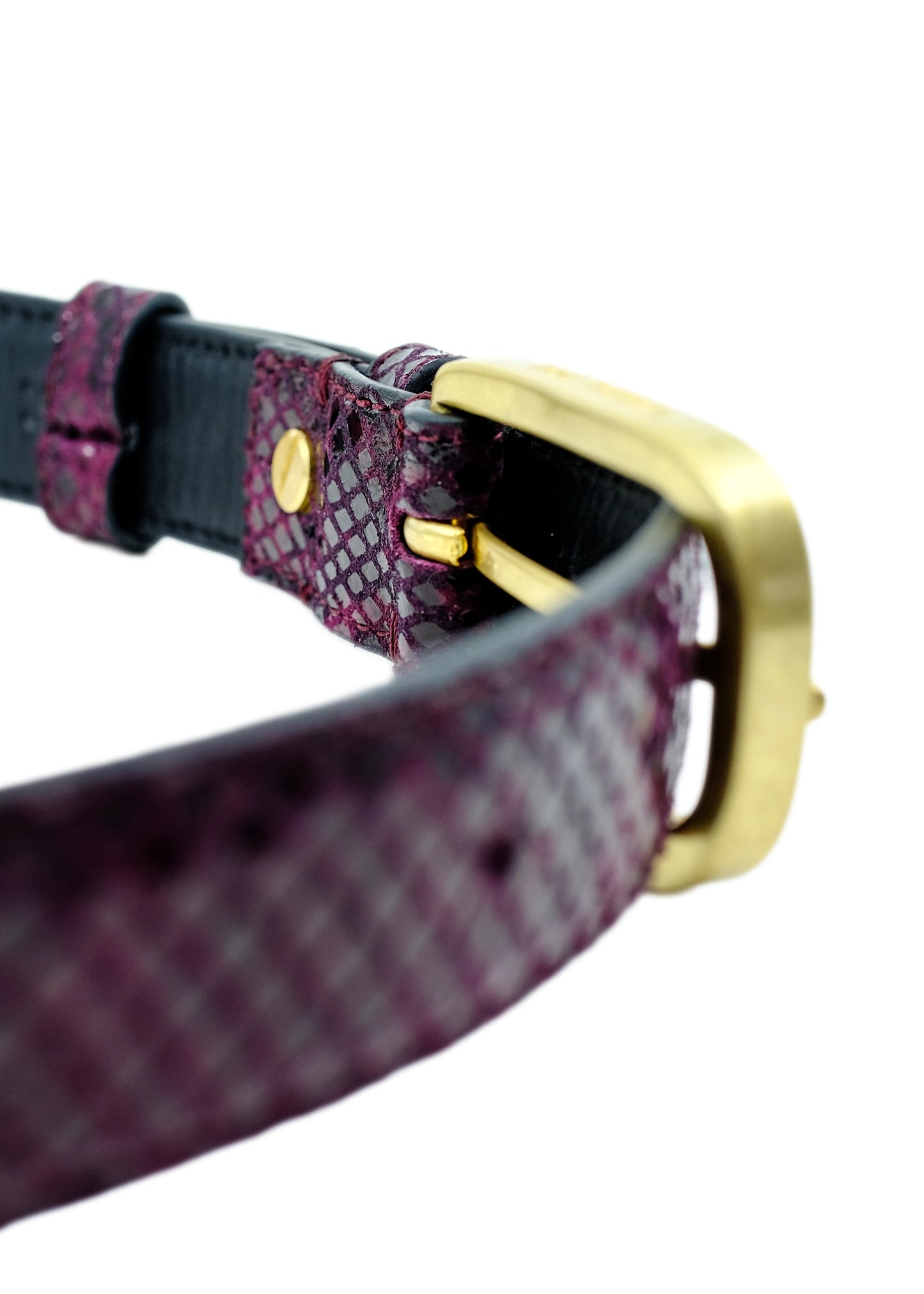 Interior view of the Dark Plum snakeskin belt, focusing on the golden buckle attachment and smooth black lining.