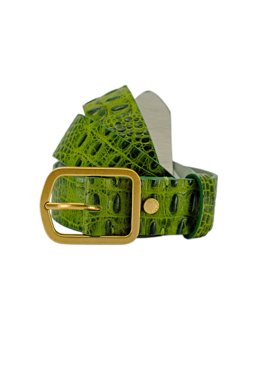 Coiled Atomic Green alligator embossed leather belt with a rectangular gold buckle, isolated on a white background.