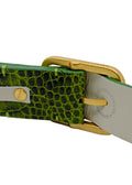 Close-up of the Atomic Green belt's gold buckle and interior lining, featuring the "Proudly Made in Portugal" stamp and high-quality green stitching.
