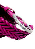 Macro shot of Barbie Pink braided belt with a matte silver buckle featuring an engraved "BIRD & ASH." logo.